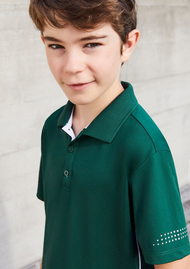 Image of a child in a playful setting wearing a Maxi Honeycomb Knit Kids Polo.