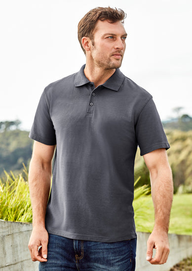 Image depicting a man in a Pique Knitted Flat Collar Men's Polo at a casual business meeting.