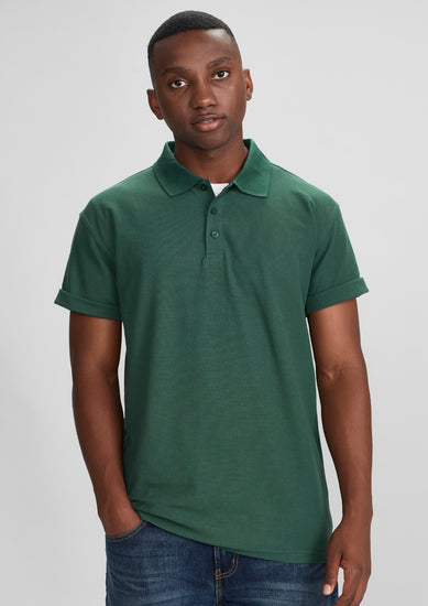 Image depicting a man in a Pique Knitted Flat Collar Men's Polo at a casual business meeting.