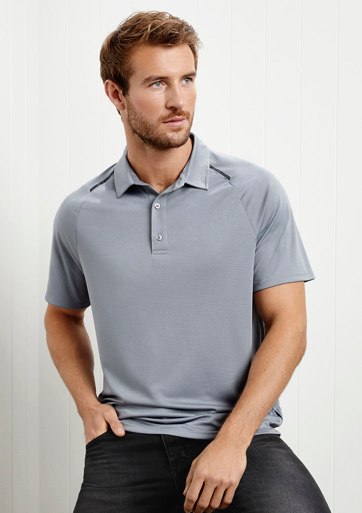 Image of a man wearing a Spartan Anti-Shrink Men's Polo in a casual office setting.